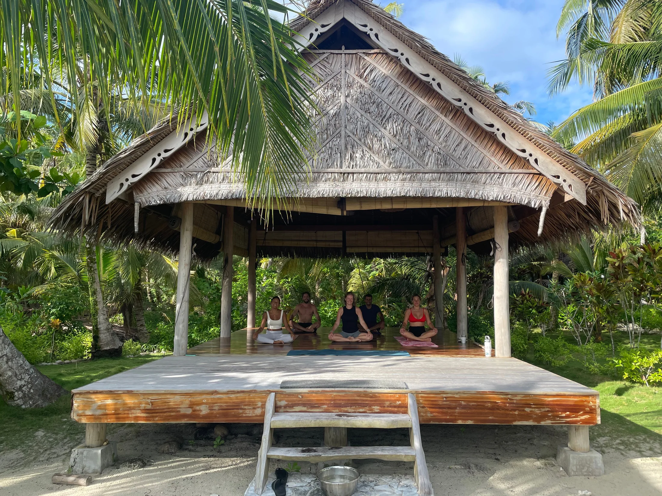 An open pavilion surrounded by nature