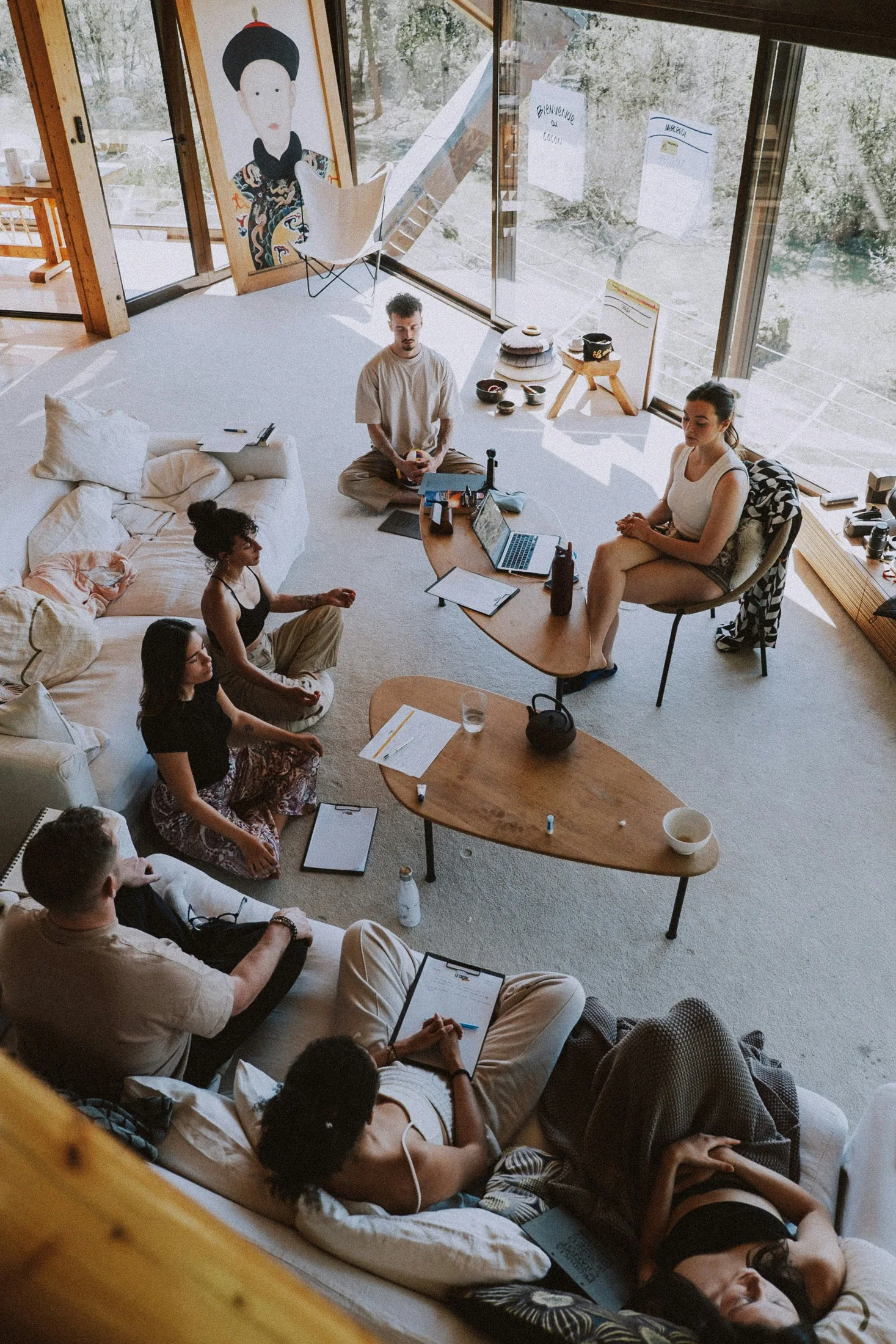 A group in conversation in a bright workshop