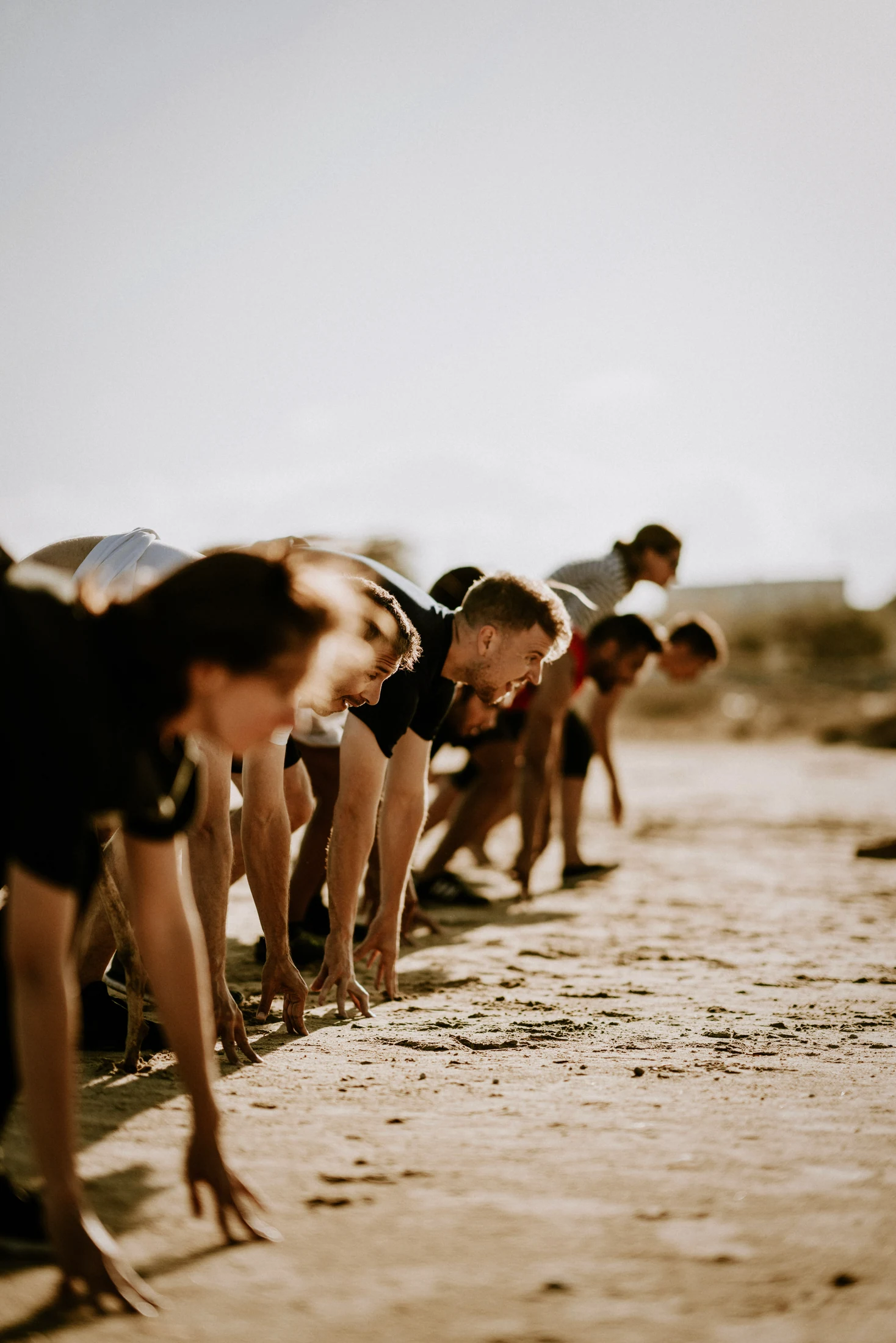 A group practises together on the beach